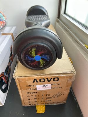 a box with a speaker on top of it in front of a window