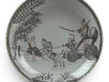 a plate that has a picture of a man on a horse drawn carriage
