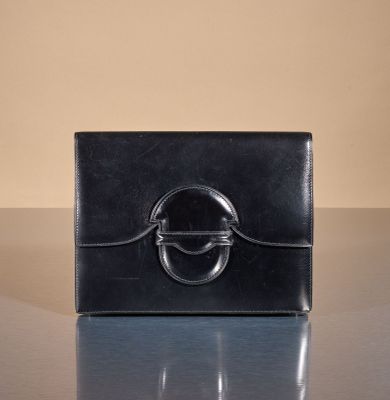 an image of a black purse on a table