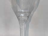 a wine glass that is sitting on a table