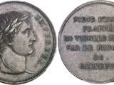 a close up of a coin with a woman ' s head on it