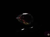 a close up of a diamond in the dark