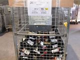 a metal cage filled with bottles of wine in a warehouse