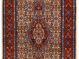 a red and blue rug with a medallion design on it