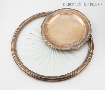 a silver plate with a bowl on top of it
