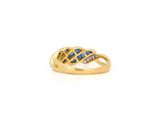 a yellow gold ring with blue sapphires and diamonds