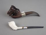 a pipe and a pipe holder on a table