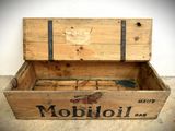 a wooden box with a sign on it that says mobbili