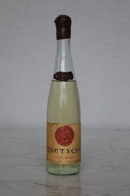 a bottle of wine that is sitting on a table