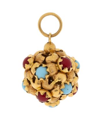 a close up of a gold and turquoise pendant on a white background