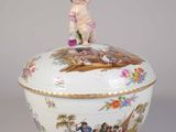 an image of a porcelain bowl with a figurine on top of it