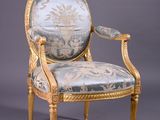 an image of a chair with a blue and gold upholstered back