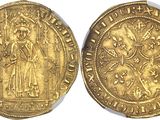 a gold coin with an image of a woman on it