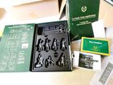 a box with a bunch of small figurines in it