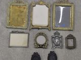a lot of picture frames that are sitting on the floor
