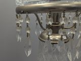 a glass lamp that is sitting on a table
