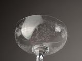 a wine glass that is sitting on top of a table