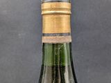 a bottle of wine that is sitting on a table