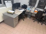 a desk with two computer monitors and a printer on it