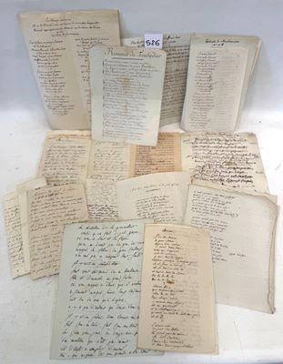 several old papers are stacked on top of each other on a table