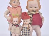three dolls that are standing next to each other