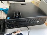 a desktop computer sitting on a desk with a keyboard and mouse