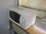 a white microwave sitting on top of a counter