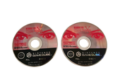 two cds that are sitting side by side on a white surface