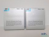 two boxes of apple products sitting on a table