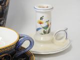 a cup and saucer sitting on a table