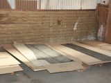 many pieces of cardboard sitting on the floor in a room