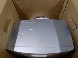a box that has a toilet inside of it