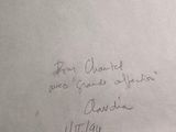 a piece of paper with a handwritten message on it
