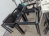 many chairs and tables that are sitting in a room