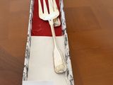 a fork and spoon in a box on a table