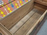 a wooden box that has a colorful design on it
