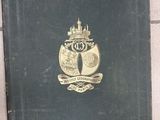 a black book with a gold emblem on it