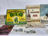 many different types of advertising items displayed on a table
