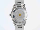 a close up of a watch on a white surface with a white background