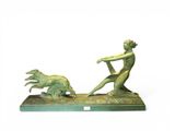 statue of a man and a dog on a base