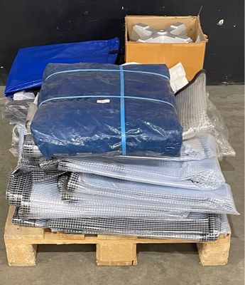 a lot of bags on a pallet next to a box