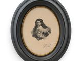 an old picture of a man with a beard in a black frame