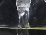 a glass vase with a liquid inside of it