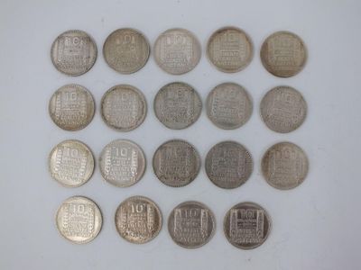 some coins are arranged in a circle on a white surface