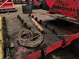 an image of a red truck with a rope on the back
