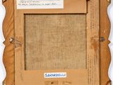 an old picture frame with a piece of paper taped to it