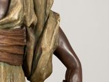 a statue of a man with a belt around his waist