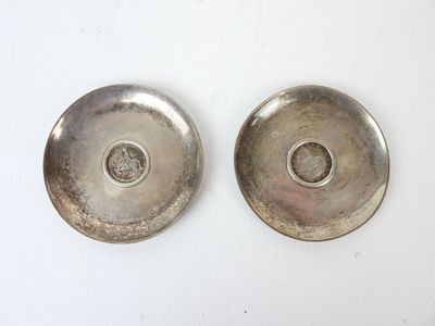 pair of silver plated bowls with a hole in the middle and a hole in the middle
