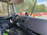 a view of the inside of a vehicle from the driver ' s seat