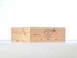a close up of a wooden box on a white surface